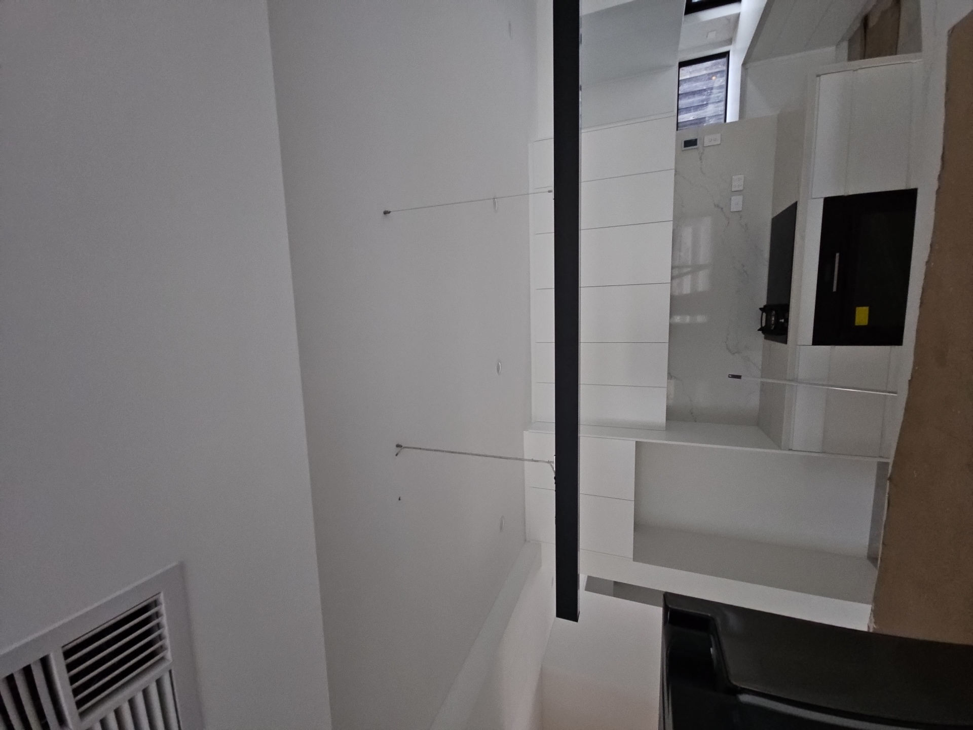 Pendant light installation over kitchen